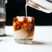 Iced,Cold,Brew,Coffee,In,A,Glass,With,Milk,Poured